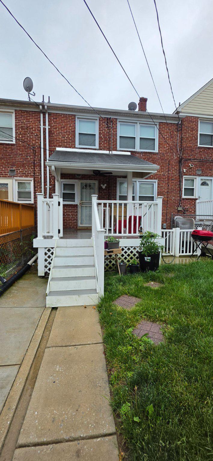1328 Cedarcroft Road Baltimore, MD 21239 - Photo 3 of 3 a front view of a building with garden
