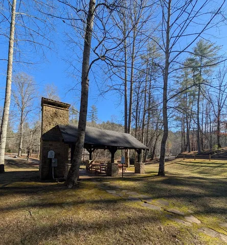 a view of a water pond with green space