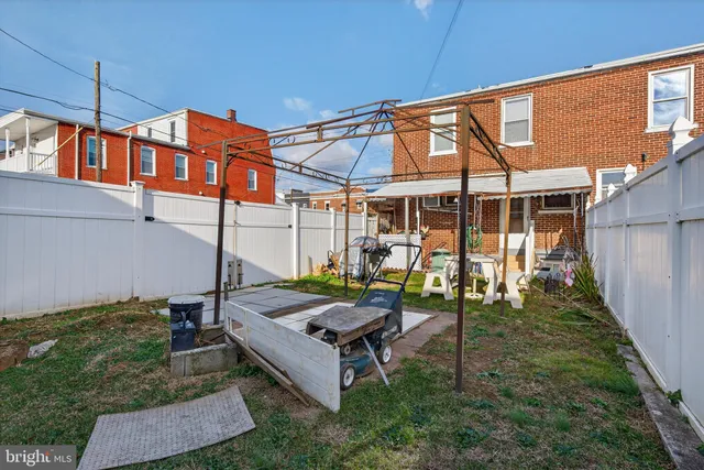 a living room with a table and chairs