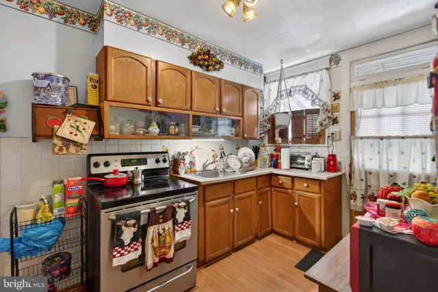 a kitchen with stainless steel appliances granite countertop a sink and cabinets