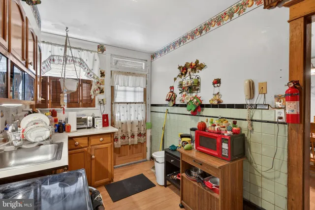 a utility room with stainless steel appliances and cabinets