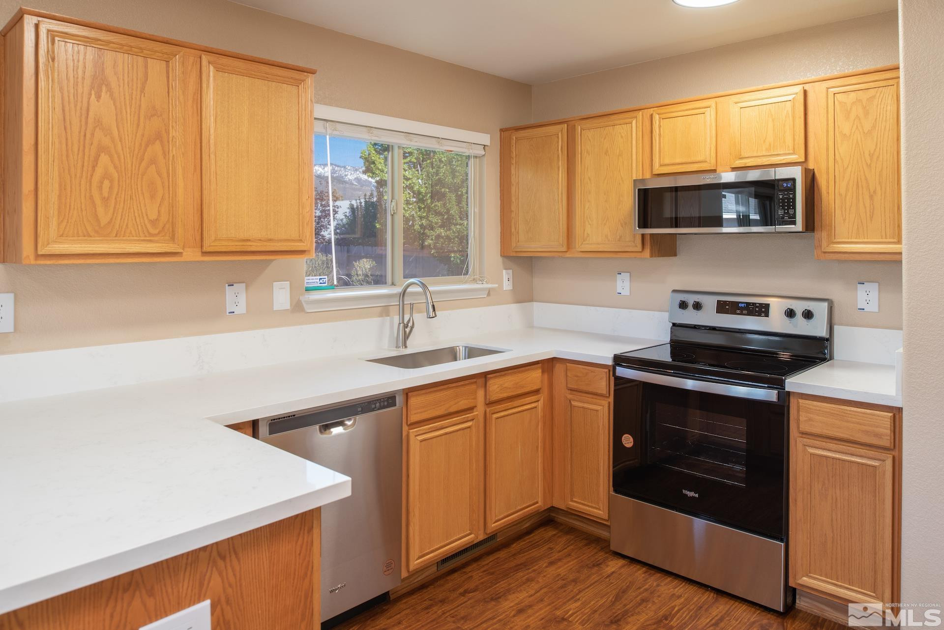 923 Ranchview Circle Carson City, NV 89705 - Photo 12 of 27 a kitchen with stainless steel appliances a stove sink and microwave