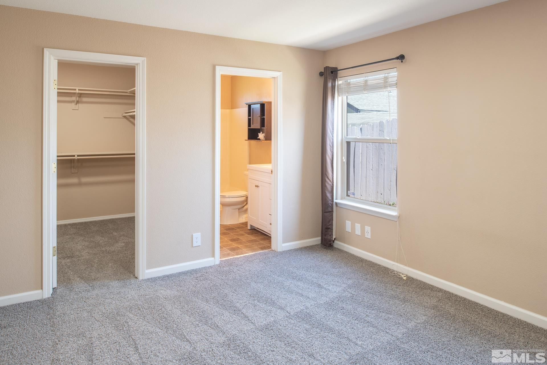 923 Ranchview Circle Carson City, NV 89705 - Photo 16 of 27 a view of an empty room with closet and a window