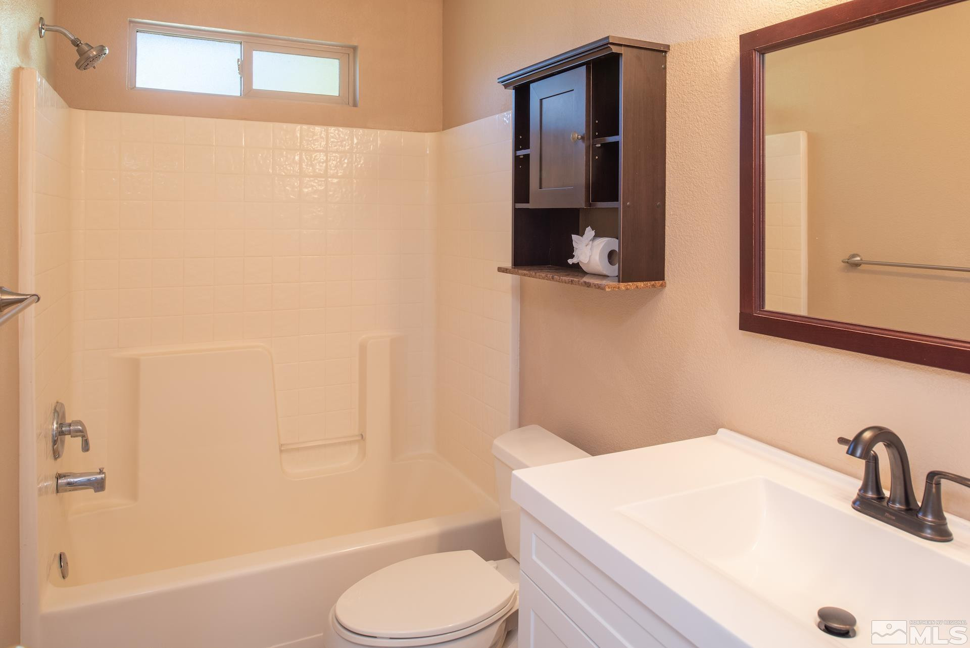 923 Ranchview Circle Carson City, NV 89705 - Photo 17 of 27 a bathroom with a sink toilet and shower