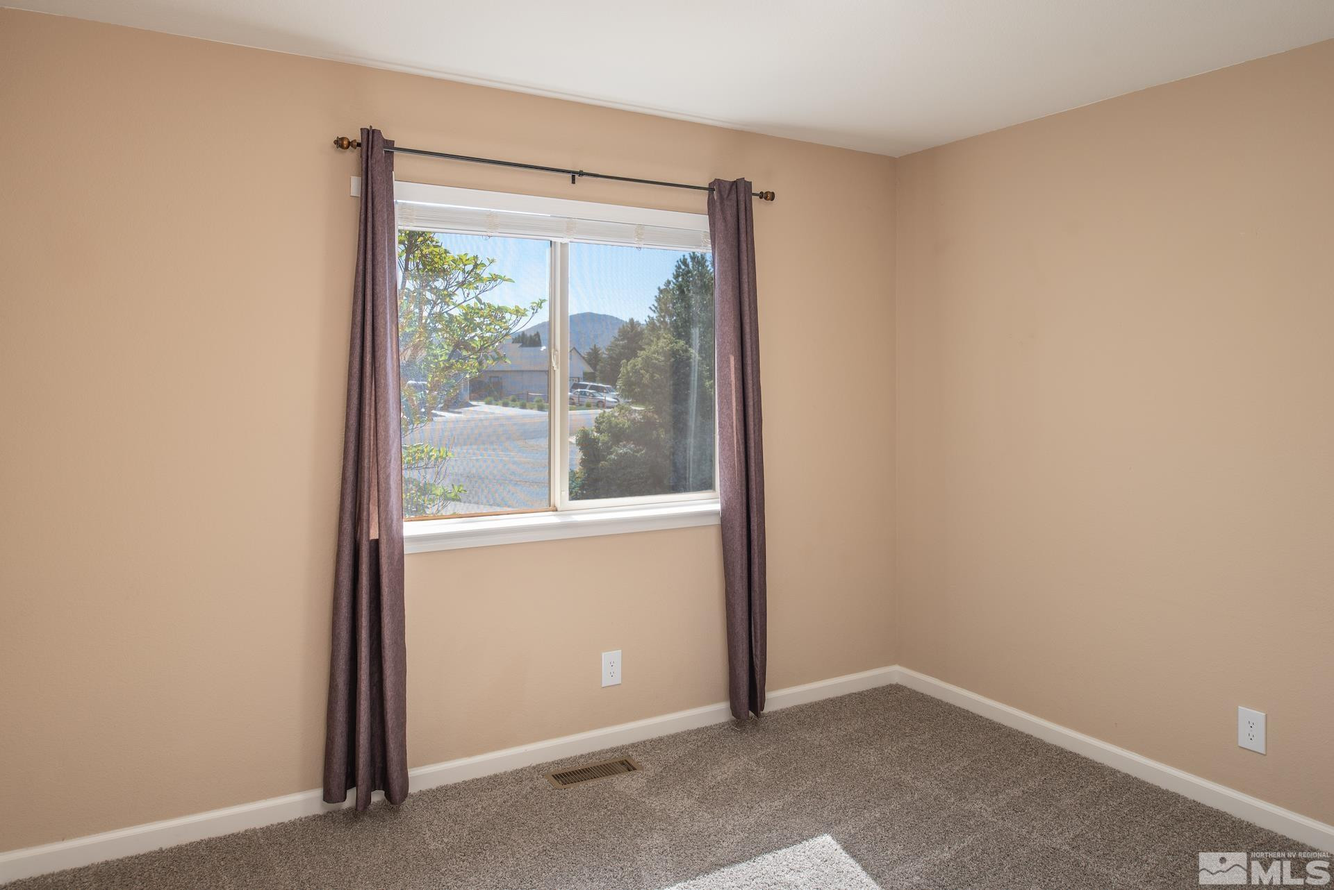 923 Ranchview Circle Carson City, NV 89705 - Photo 19 of 27 a view of an empty room with a window