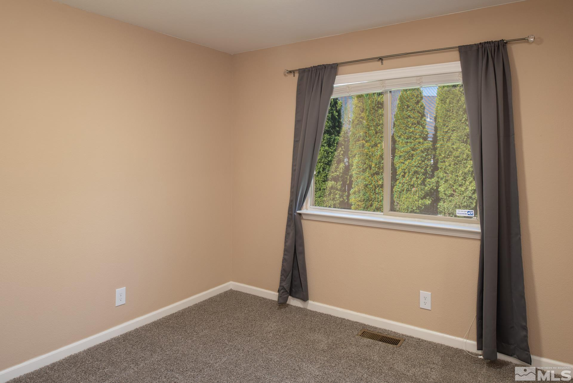 923 Ranchview Circle Carson City, NV 89705 - Photo 20 of 27 a view of an empty room with a window