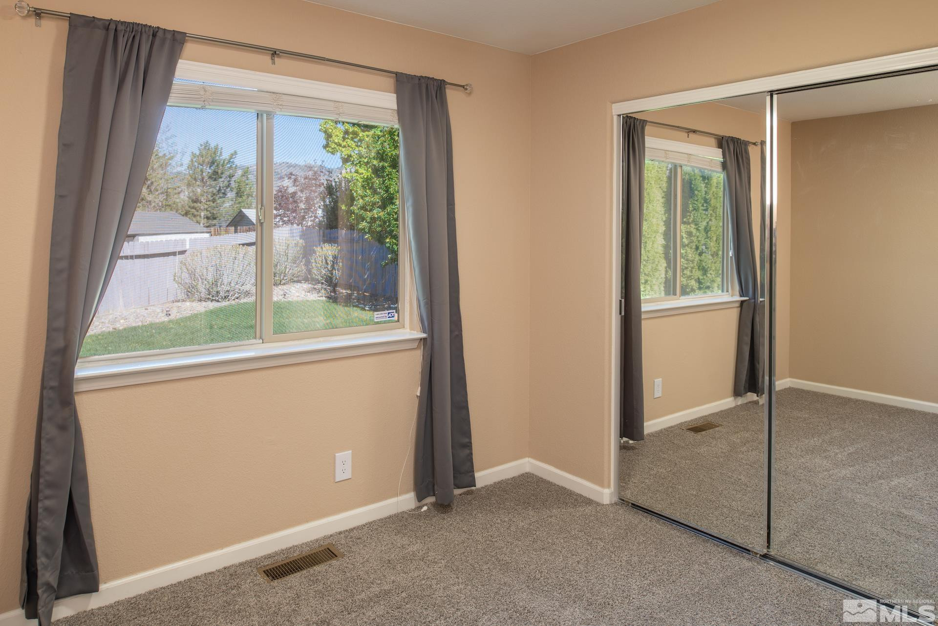 923 Ranchview Circle Carson City, NV 89705 - Photo 21 of 27 an empty room with windows