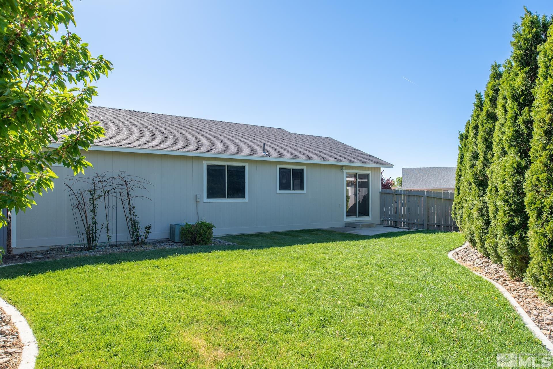 923 Ranchview Circle Carson City, NV 89705 - Photo 27 of 27 a house view with a garden space