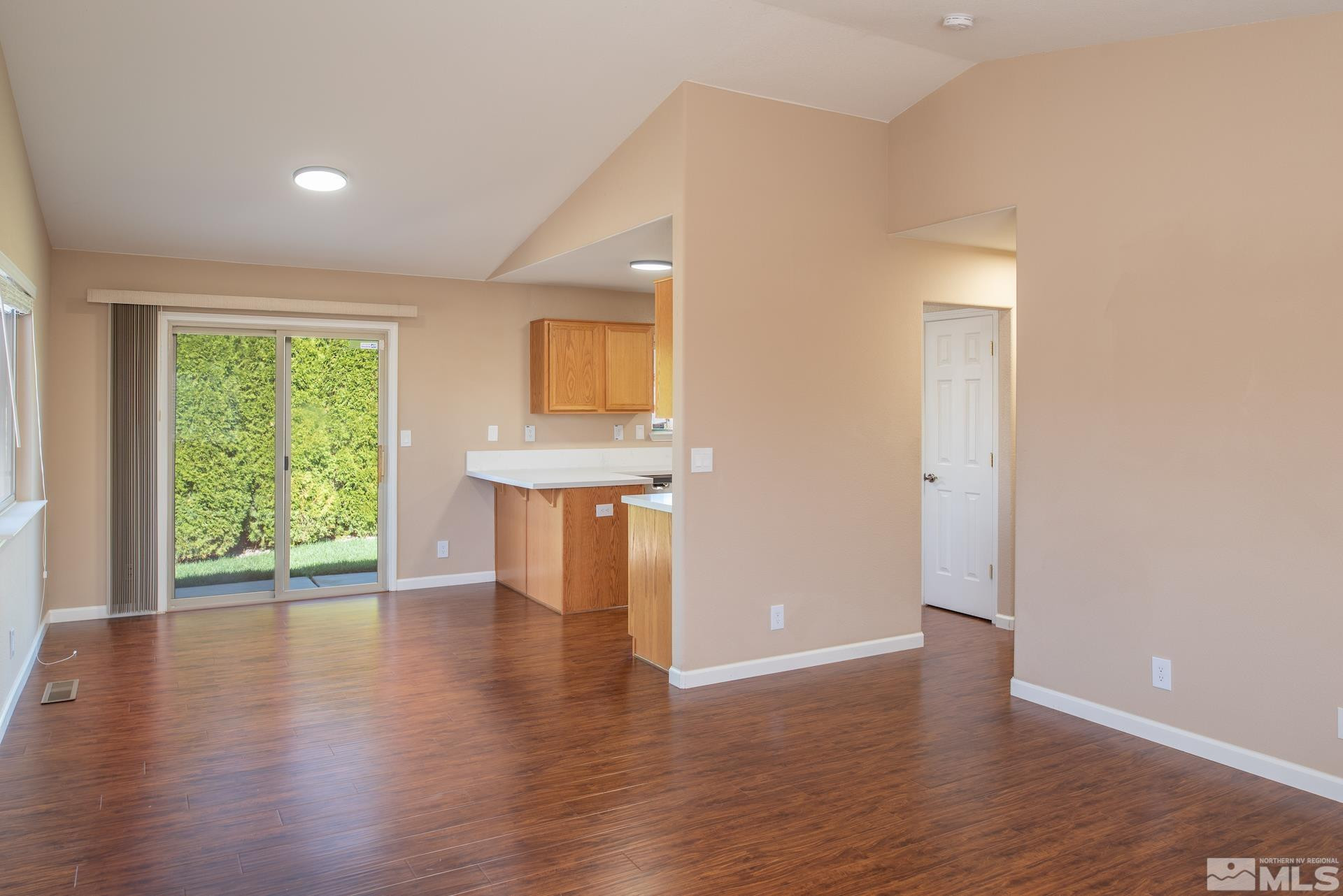 923 Ranchview Circle Carson City, NV 89705 - Photo 9 of 27 a view of empty room with wooden floor and fan