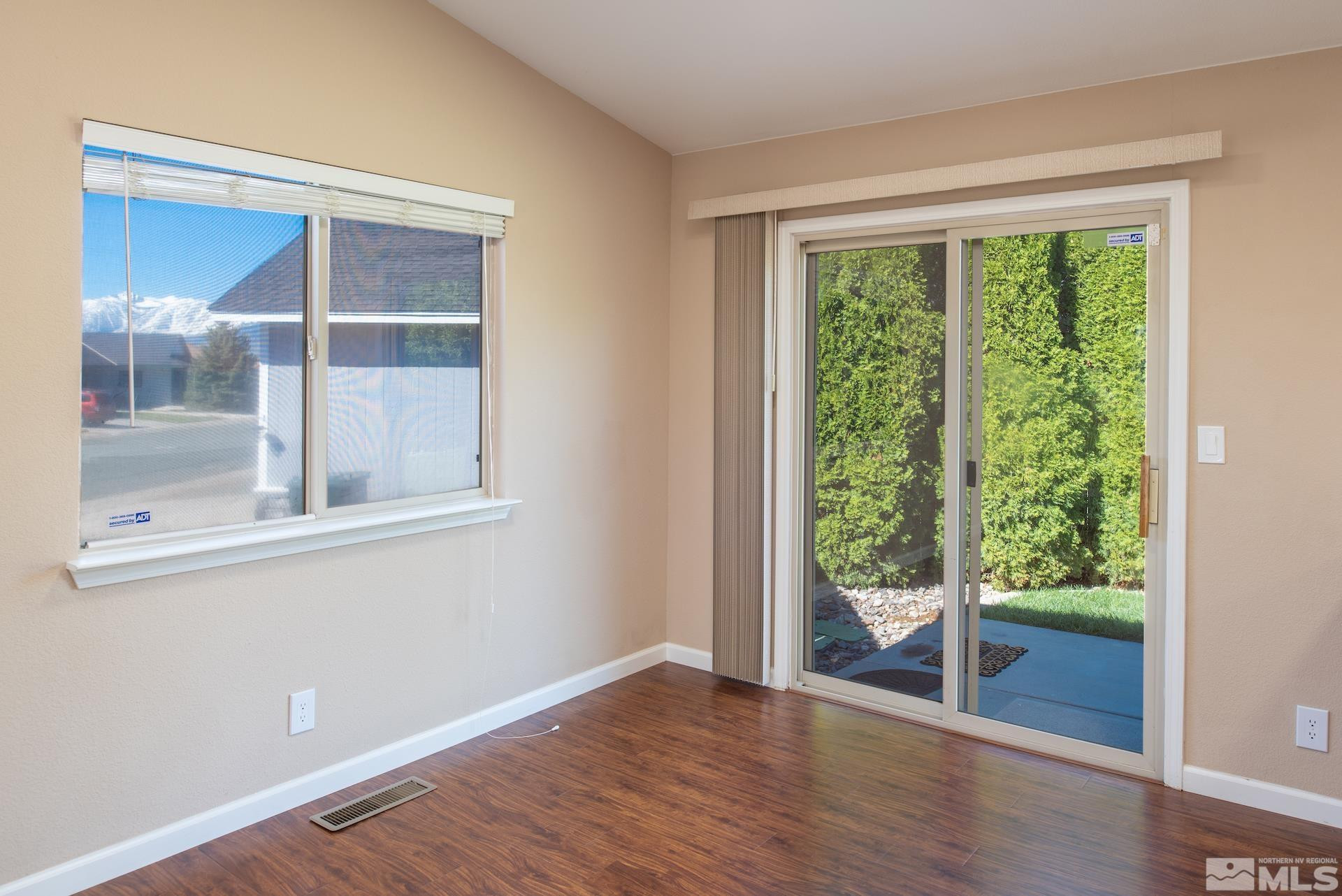 923 Ranchview Circle Carson City, NV 89705 - Photo 10 of 27 a view of empty room with wooden floor and fan