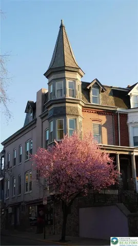 a front view of a house with yard