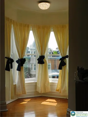 a view of balcony with two chair and a potted plant