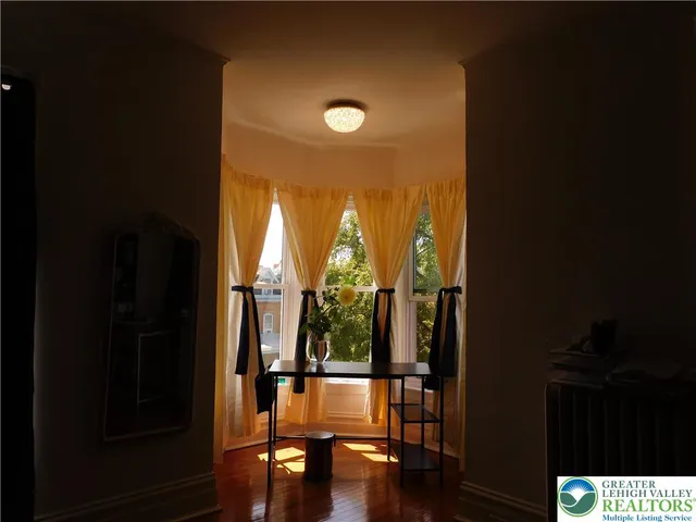 a kitchen with granite countertop cabinets and window