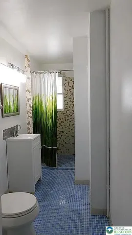 a view of a room with wooden floor and outdoor space