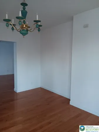 a view of living room with furniture and a large window