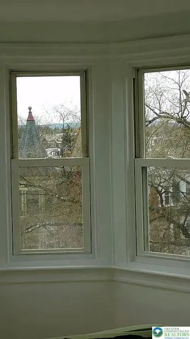a view of living room with furniture and a large window
