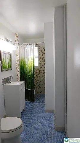 a view of a room with a window and dining area