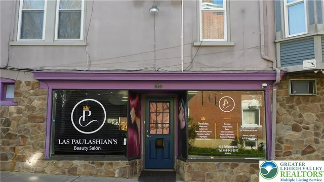 a view of a lake with a table and chairs