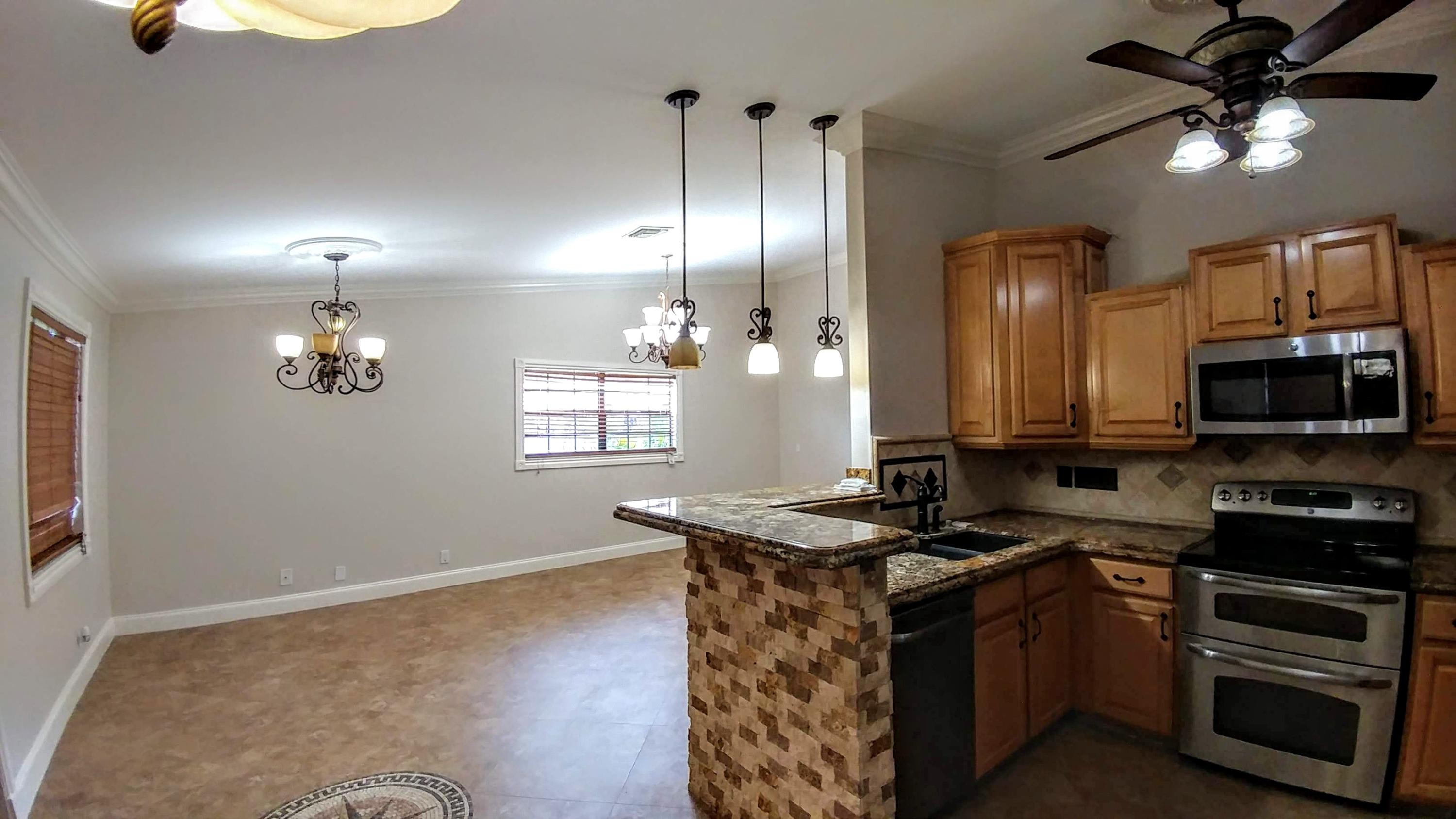 10622 Boca Entrada Boulevard Boca Raton, FL 33428 - Photo 5 of 22 Kitchen and livingroom view