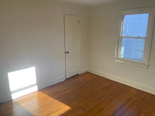 419 Front Avenue Salem, VA 24153 - Photo 8 of 14 an empty room with wooden floor and windows