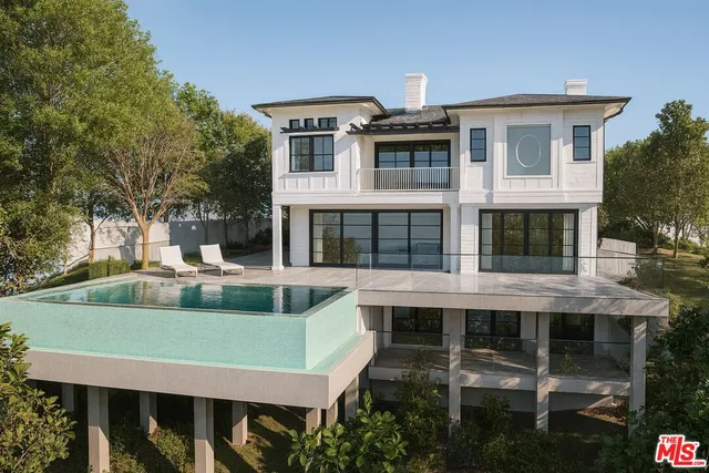 a view of house with a yard and furniture