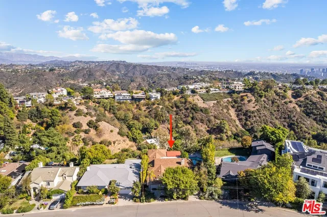 an aerial view of a house with outdoor space