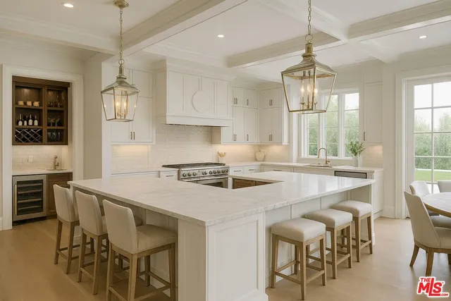 a kitchen with stainless steel appliances a dining table chairs and white cabinets