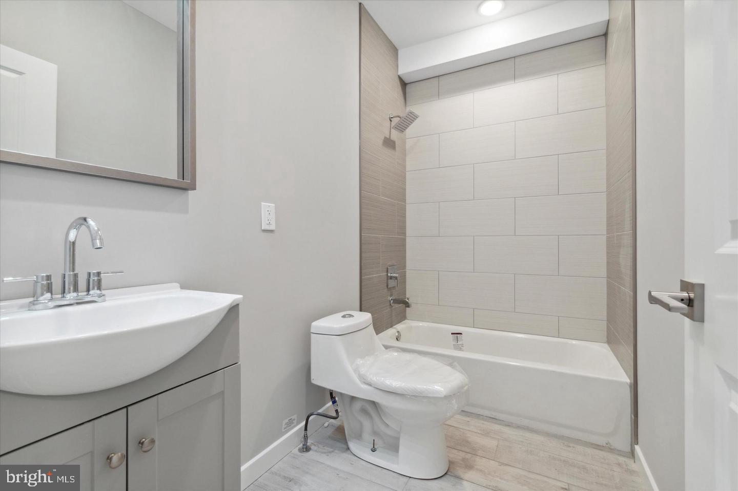 2424 Nicholas Street Philadelphia, PA 19121 - Photo 13 of 18 a bathroom with a sink a toilet and shower