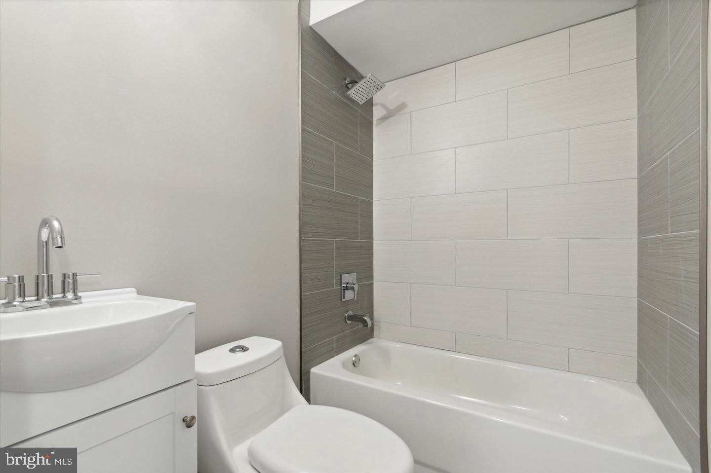 2424 Nicholas Street Philadelphia, PA 19121 - Photo 16 of 18 a bathroom with a toilet a sink and bathtub