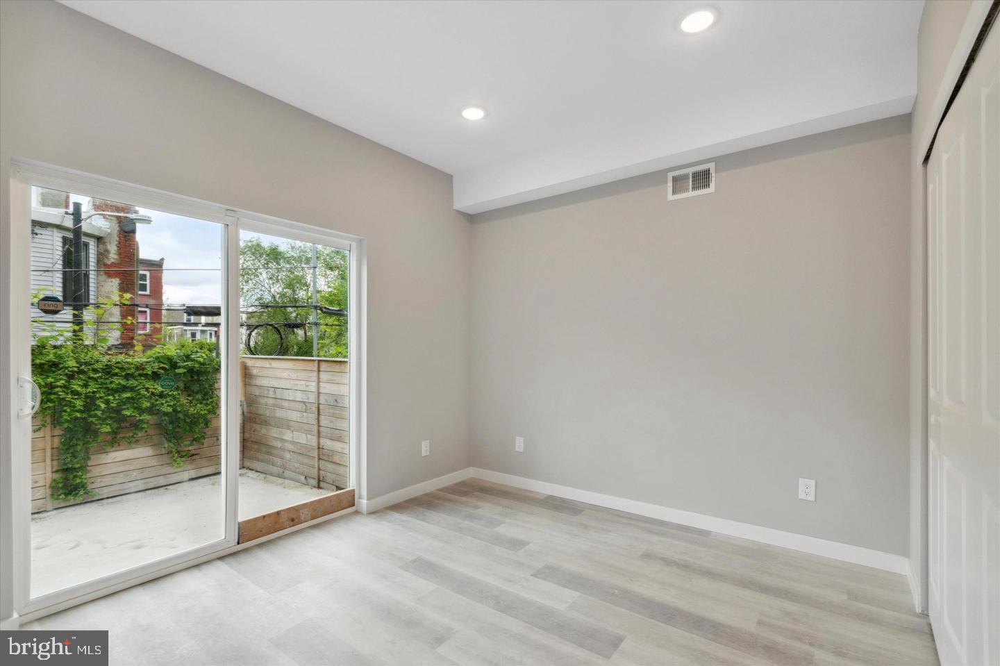 2424 Nicholas Street Philadelphia, PA 19121 - Photo 17 of 18 a view of an empty room with glass door