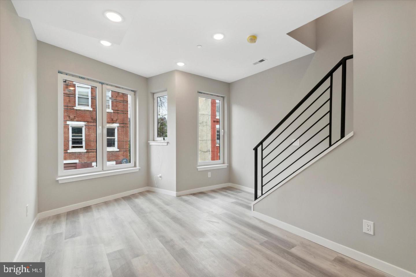 2424 Nicholas Street Philadelphia, PA 19121 - Photo 9 of 18 a view of an entryway with wooden floor and windows