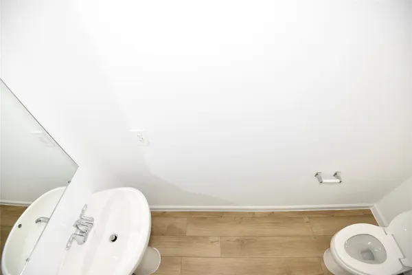 a bathroom with a toilet and a sink