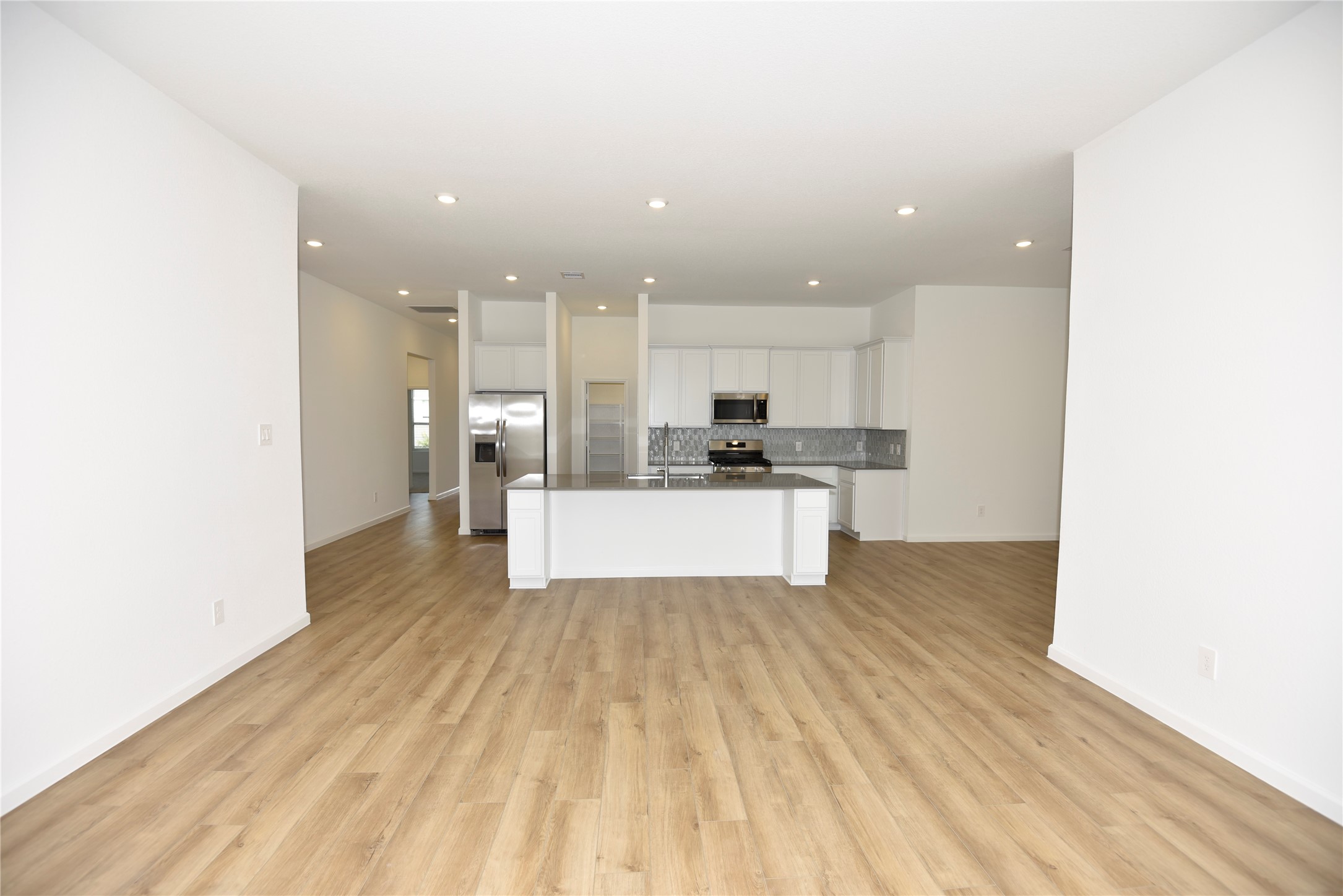 15524 Leopard Lily Lane Conroe, TX 77302 - Photo 24 of 47 a view of kitchen with wooden floor