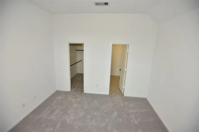 a view of a room with white walls