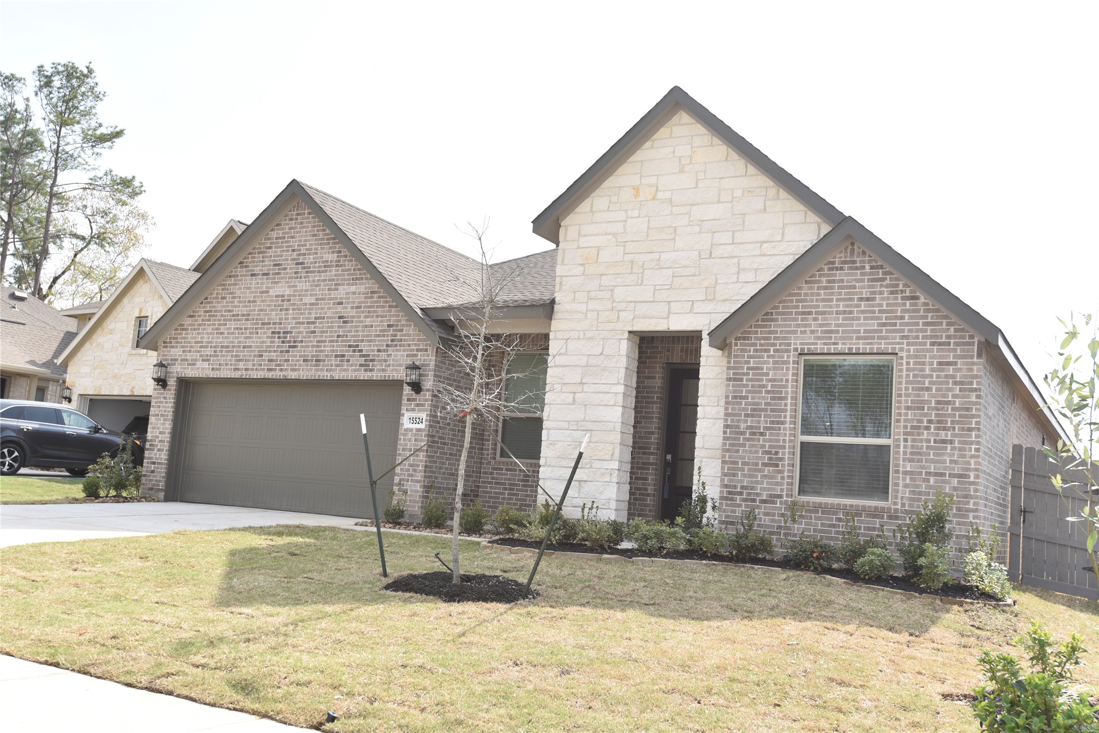15524 Leopard Lily Lane Conroe, TX 77302 - Photo 3 of 47 a view of house with yard