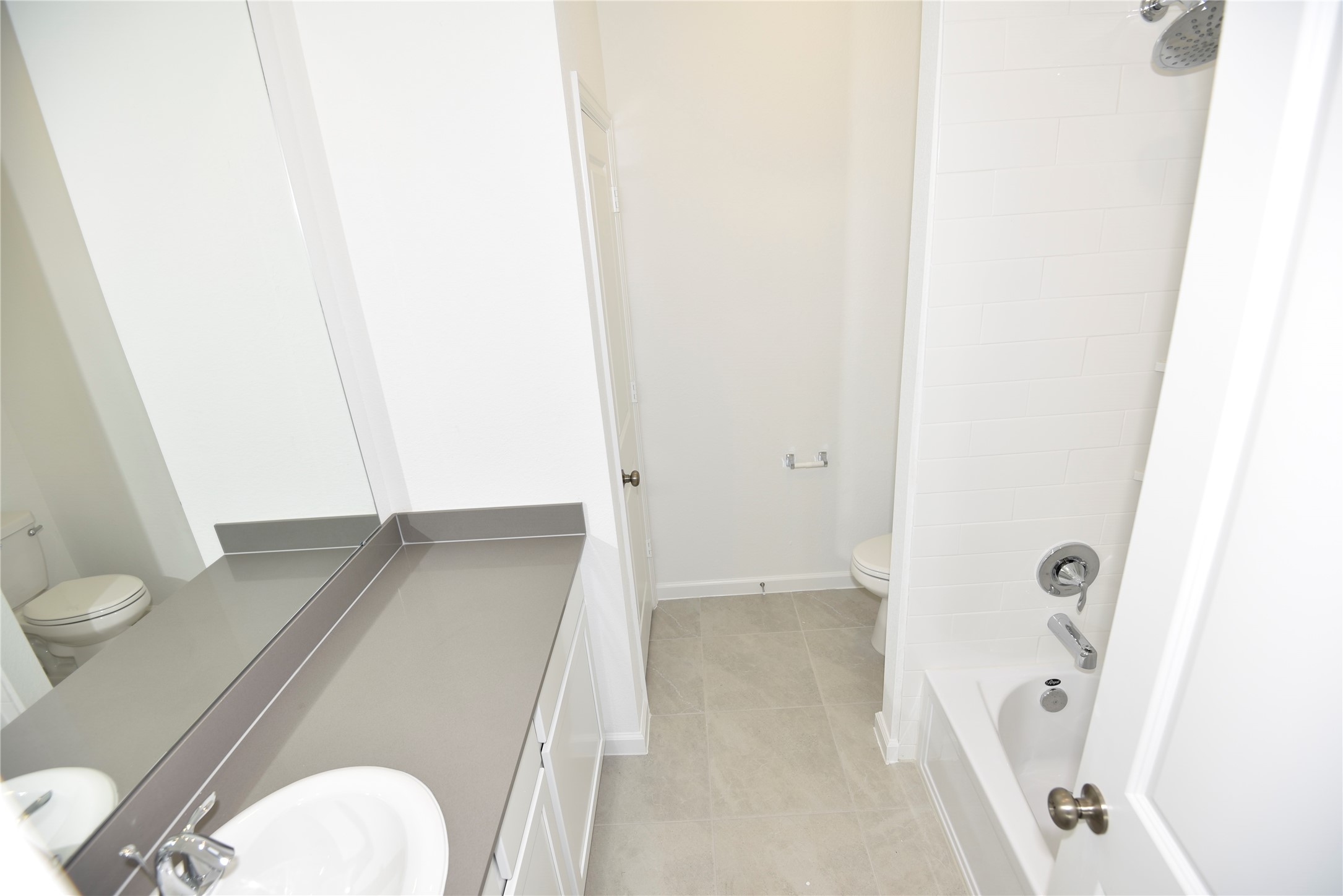 15524 Leopard Lily Lane Conroe, TX 77302 - Photo 33 of 47 a bathroom with a sink and toilet