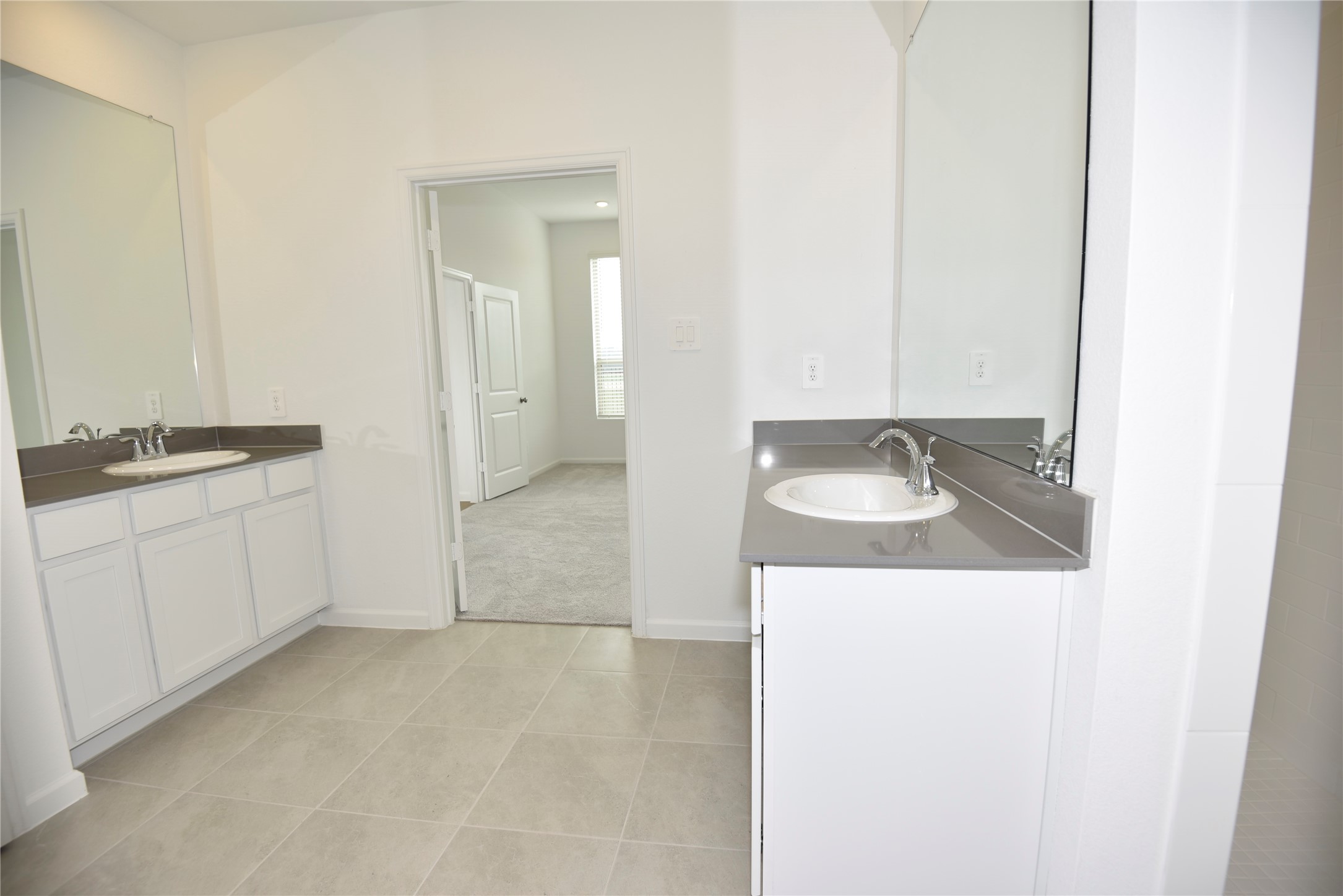 15524 Leopard Lily Lane Conroe, TX 77302 - Photo 37 of 47 a bathroom with a sink and a mirror