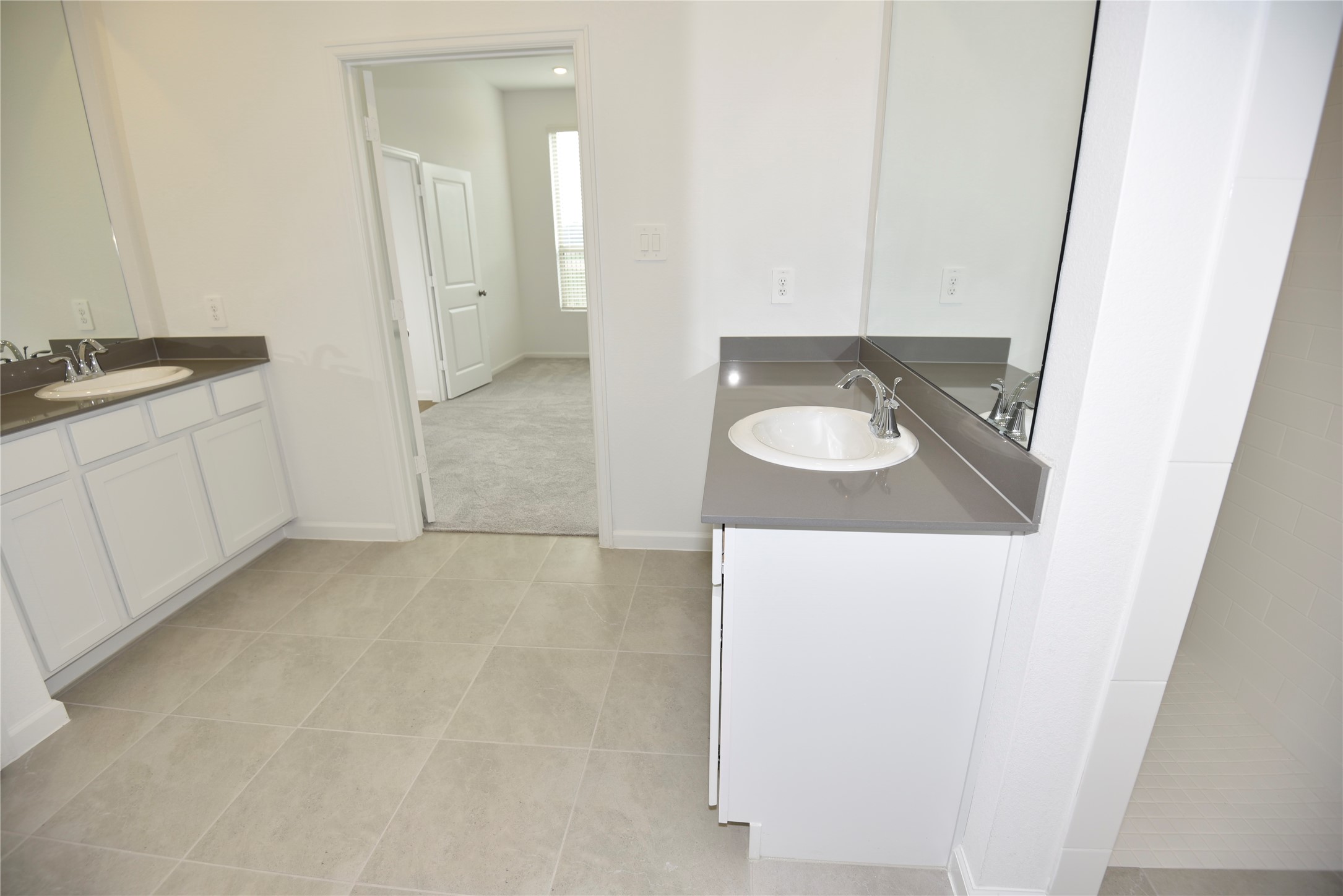 15524 Leopard Lily Lane Conroe, TX 77302 - Photo 38 of 47 a bathroom with a sink and a mirror