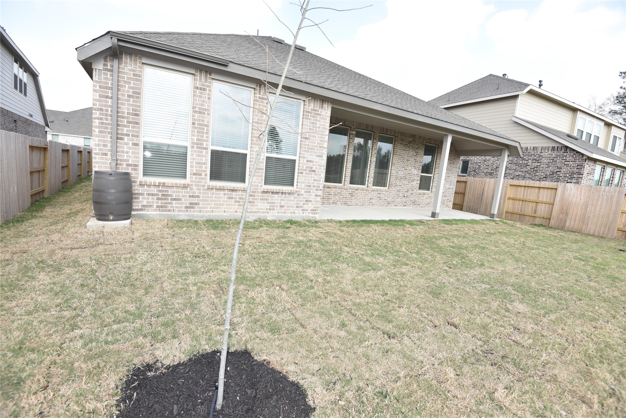 15524 Leopard Lily Lane Conroe, TX 77302 - Photo 46 of 47 a house view with a outdoor space
