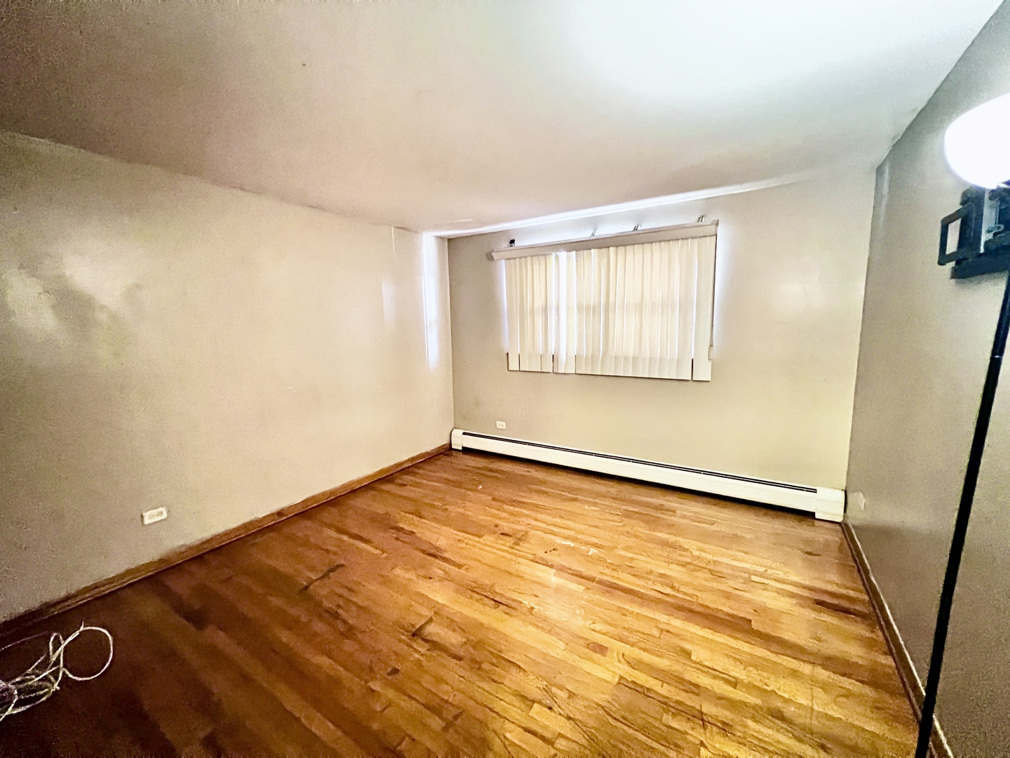11903 Gregory Street, Unit 3 Blue Island, IL 60406 - Photo 3 of 9 a view of an empty room with a window