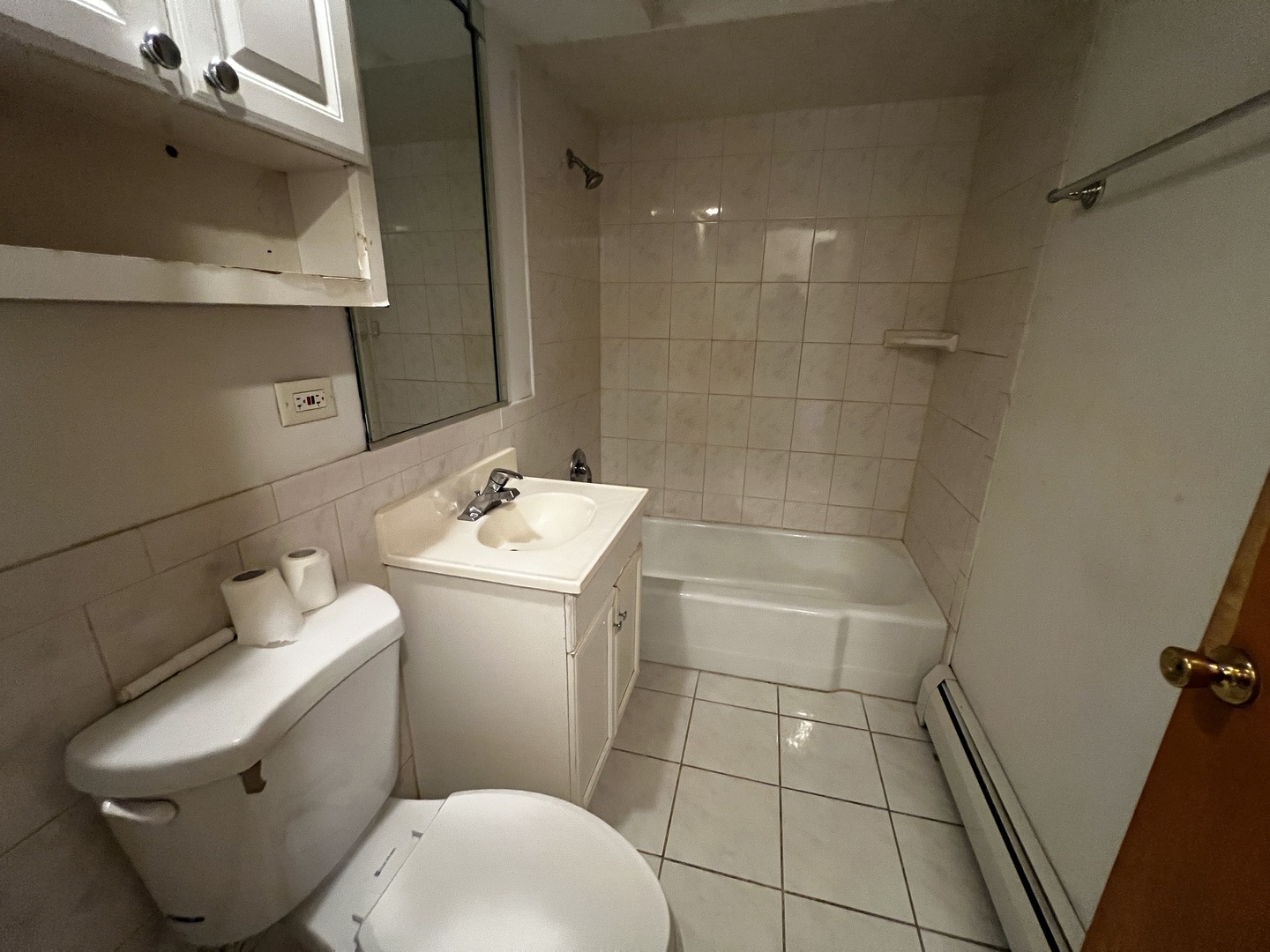 11903 Gregory Street, Unit 3 Blue Island, IL 60406 - Photo 9 of 9 a bathroom with a sink a toilet and shower