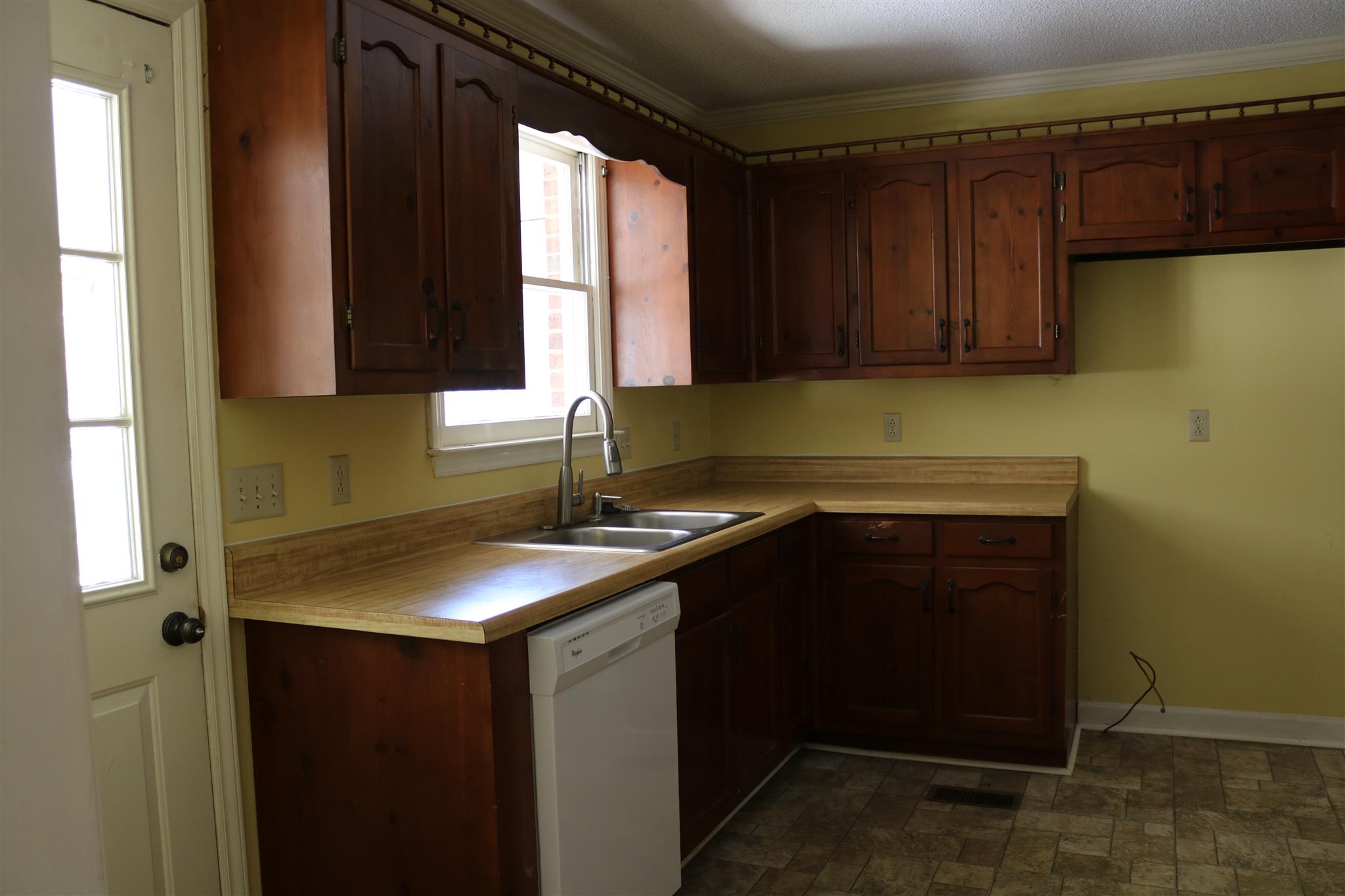2306 Sulphur Springs Road Murfreesboro, TN 37129 - Photo 5 of 13 Solid wood cabinets in the kitchen can be saved and refurbished! New paint and flooring will bring this kitchen a long way!