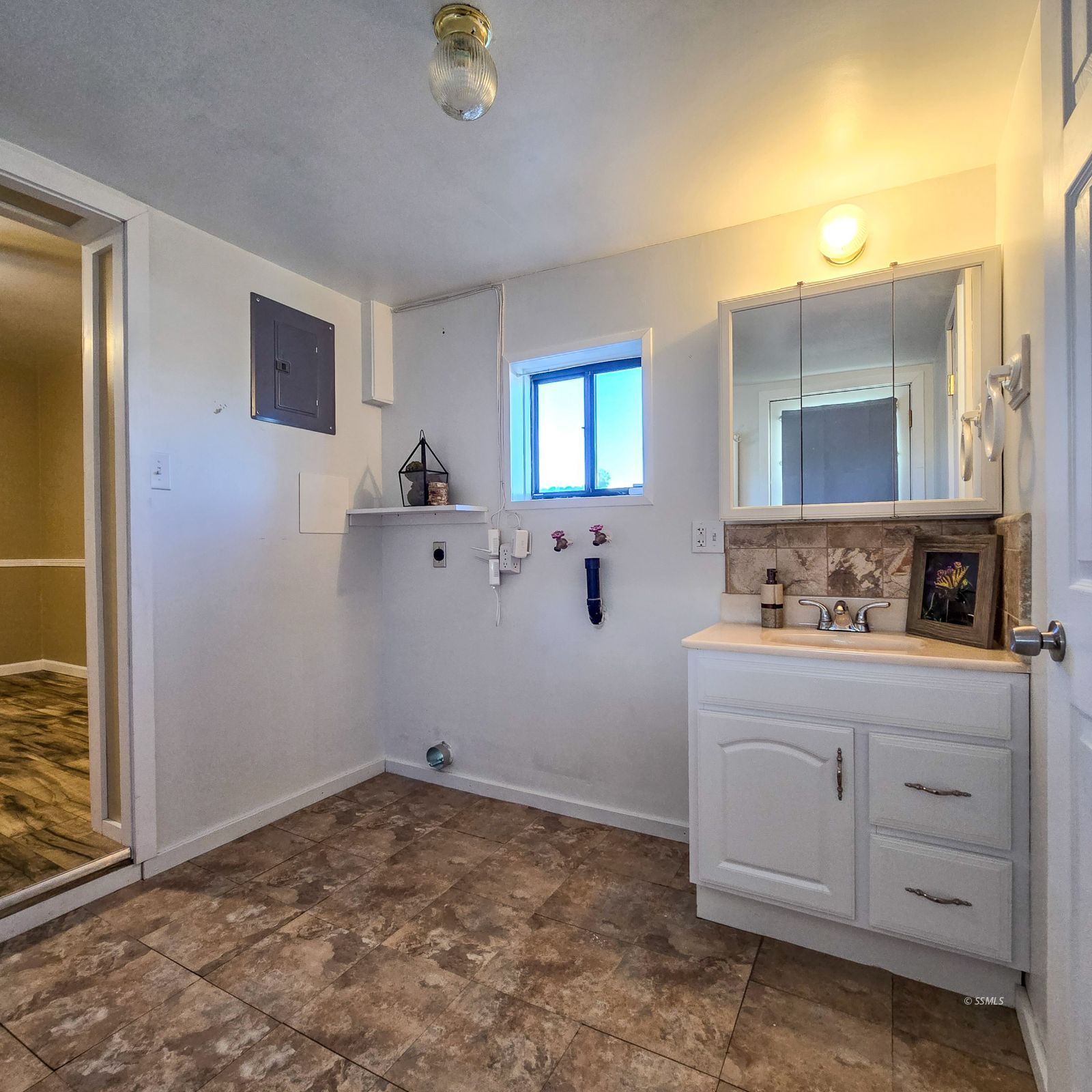 1436 Mayo Street Ridgecrest, CA 93555 - Photo 23 of 29 a bathroom with a sink and a mirror