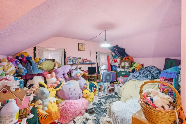 a living room with lots of baby toys