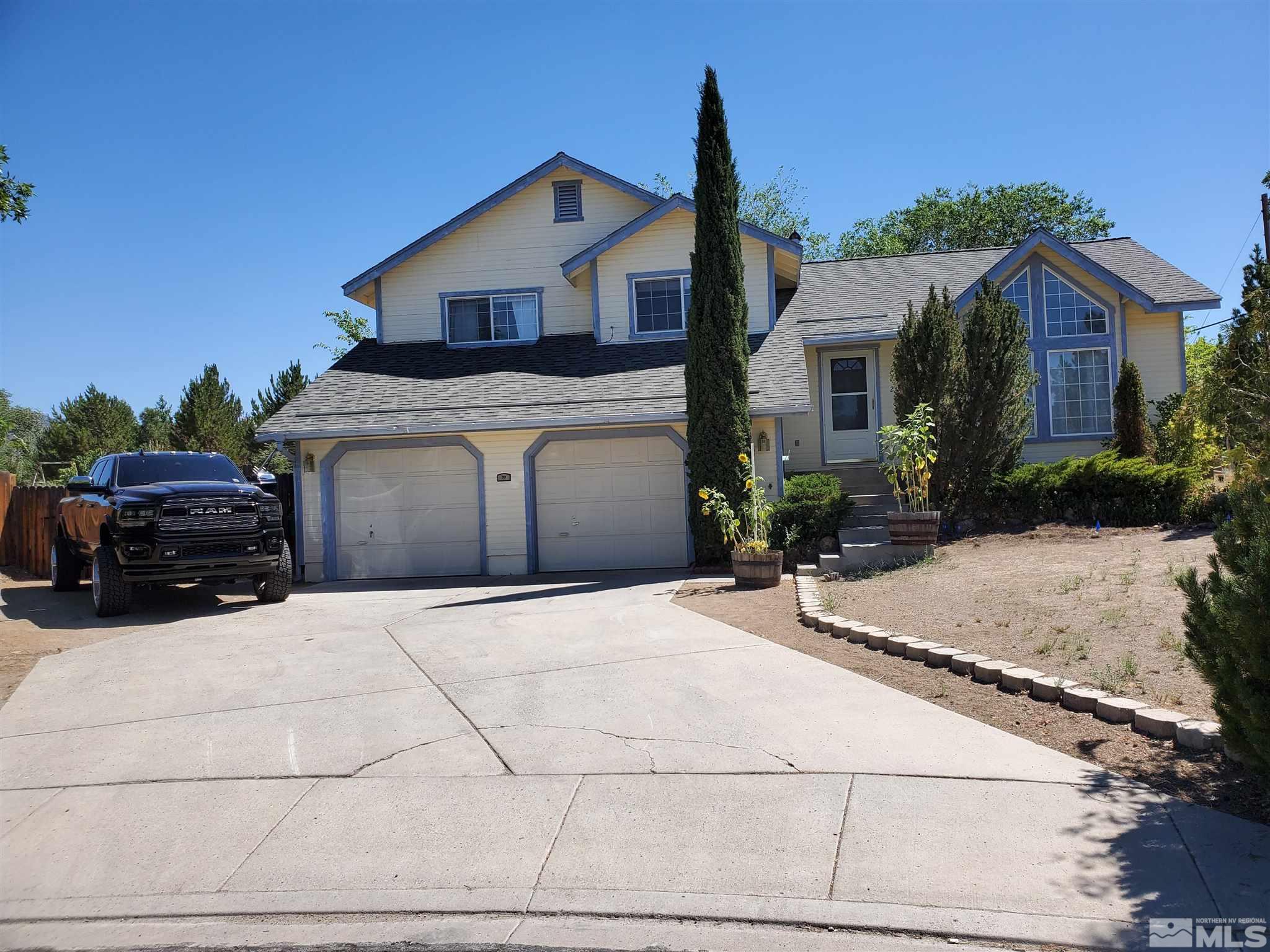 20 Sylvester Court Reno, NV 89521 - Photo 12 of 21 a front view of a house with cars parked