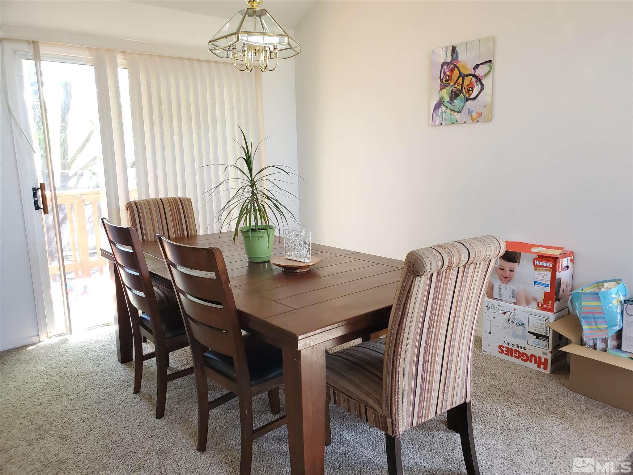 20 Sylvester Court Reno, NV 89521 - Photo 3 of 21 a view of a dining room with furniture window and outside view