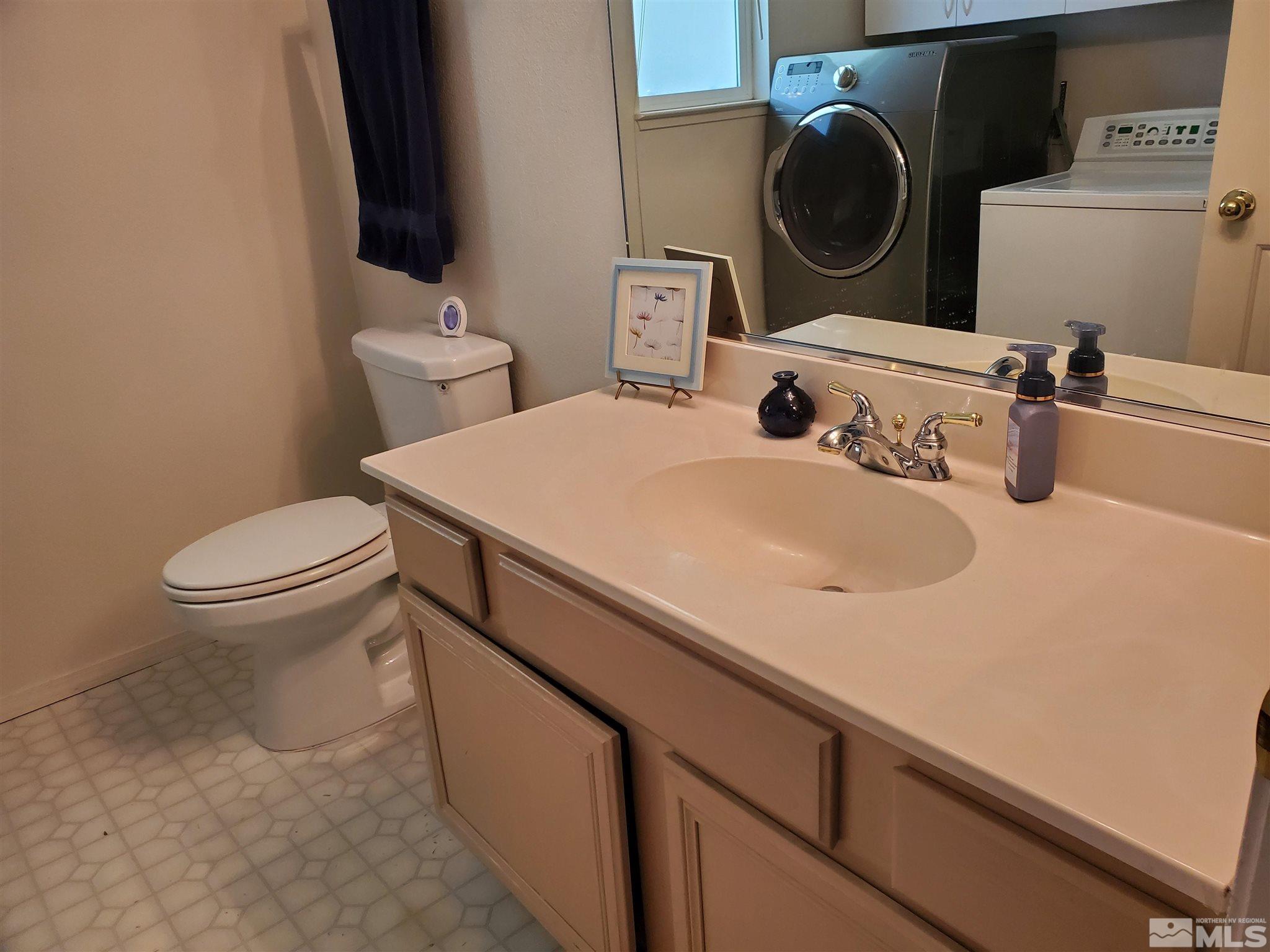 20 Sylvester Court Reno, NV 89521 - Photo 5 of 21 a bathroom with a sink and a toilet