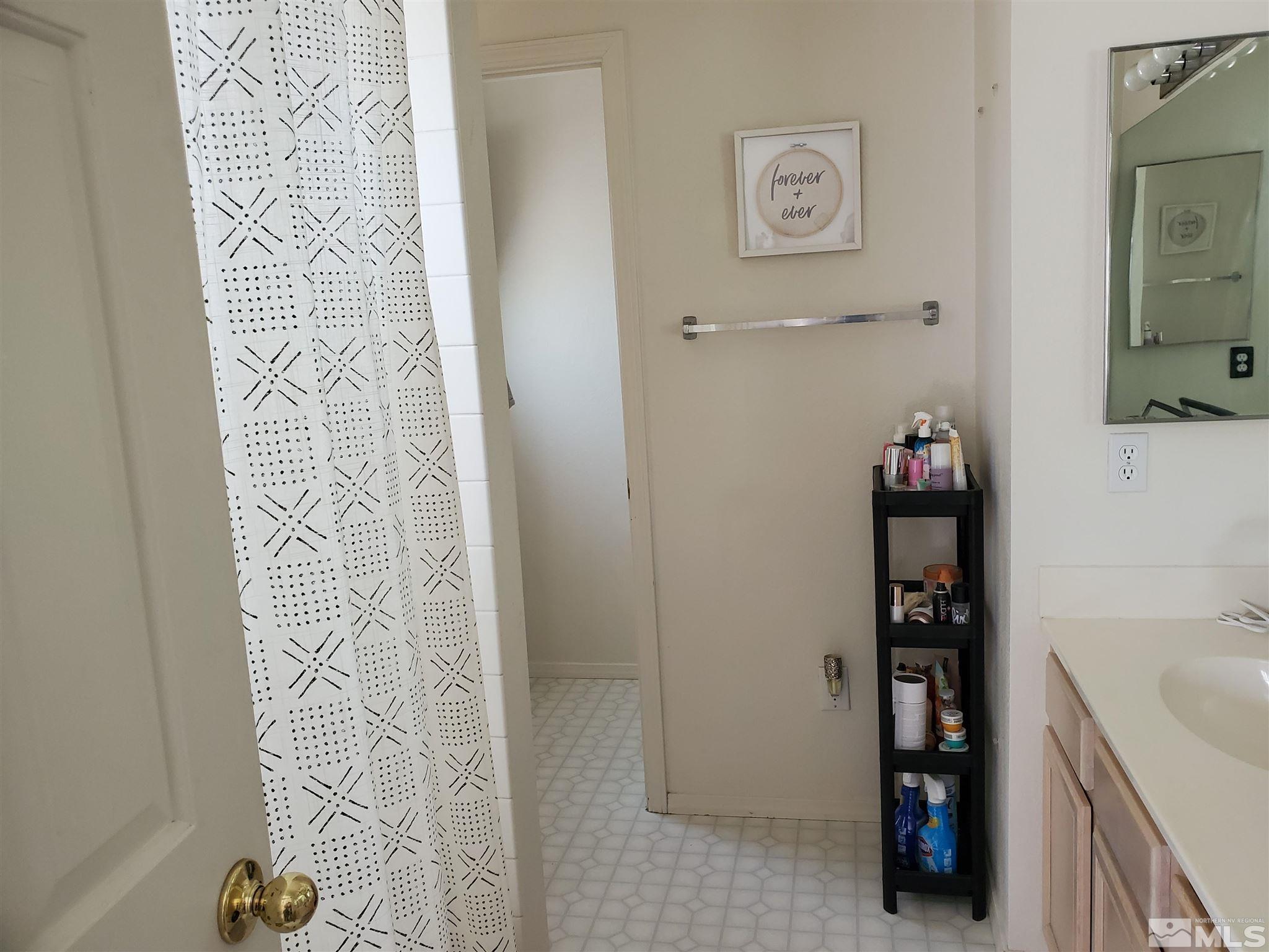 20 Sylvester Court Reno, NV 89521 - Photo 6 of 21 a bathroom with a shower and a sink