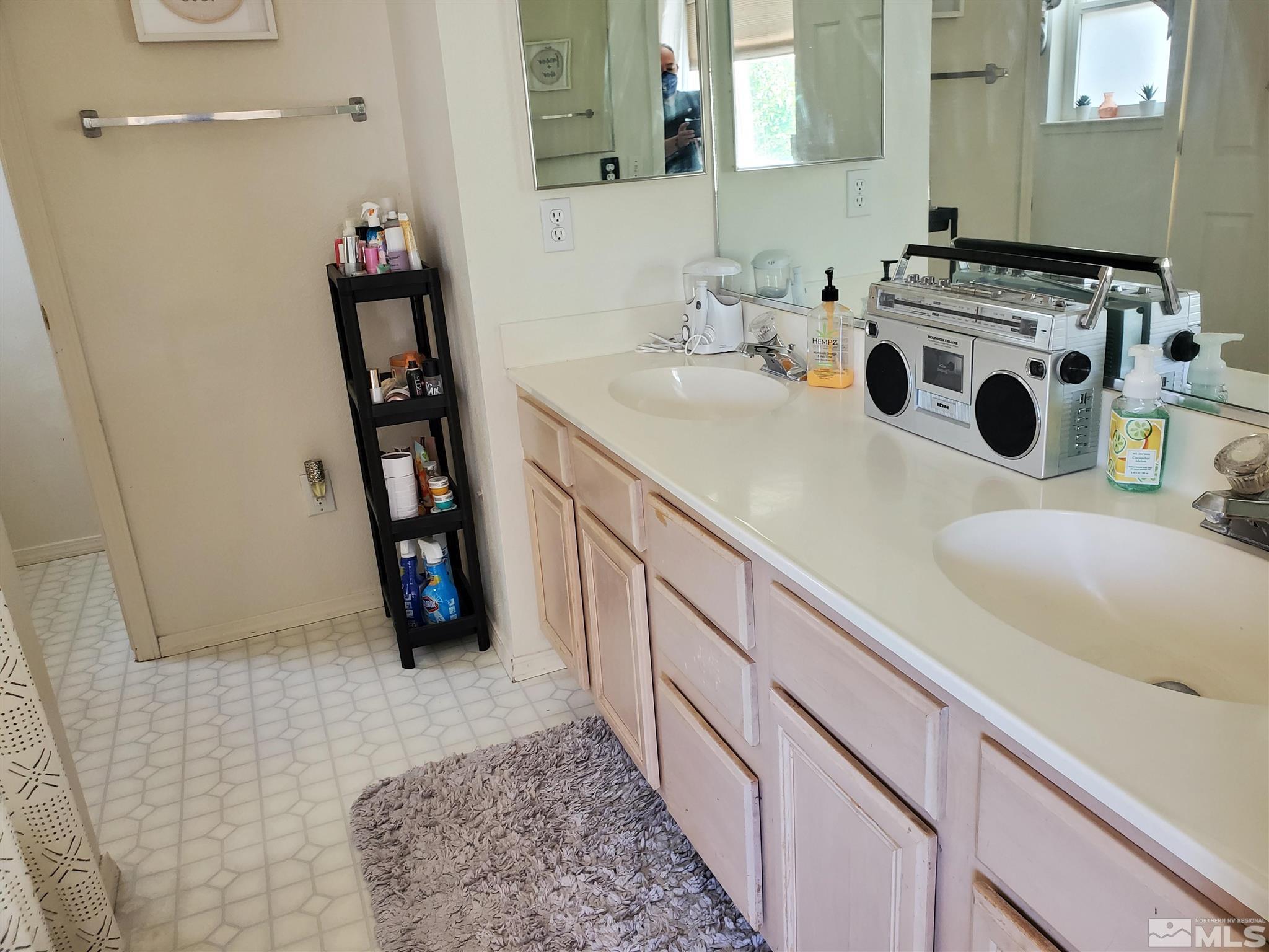 20 Sylvester Court Reno, NV 89521 - Photo 7 of 21 a bathroom with a sink and a mirror