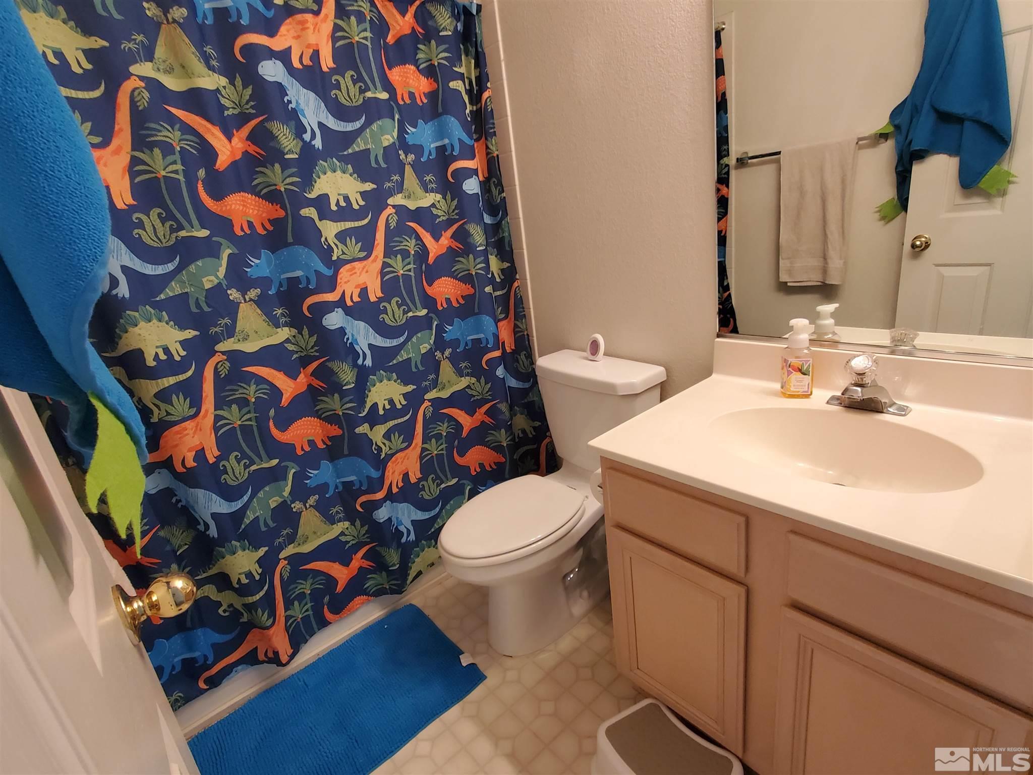 20 Sylvester Court Reno, NV 89521 - Photo 9 of 21 a bathroom with a sink toilet and shower